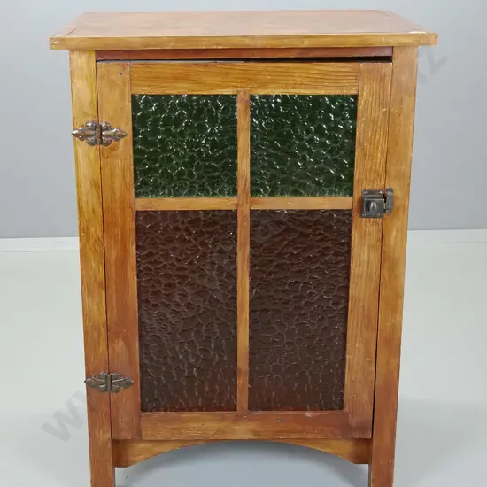 deco style pine or oregon storage cupboard with rippled coloured glass door - skirting trim missing from both sides,