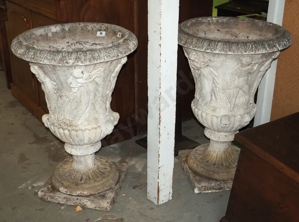 pair of classical style concrete garden urns on fluted base with cavorting maidens in relief H-830 Diam-580 Image 1++