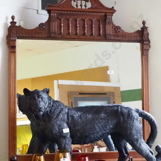 walnut reproduction over-mantle mirror, having shaped crest with turned gallery