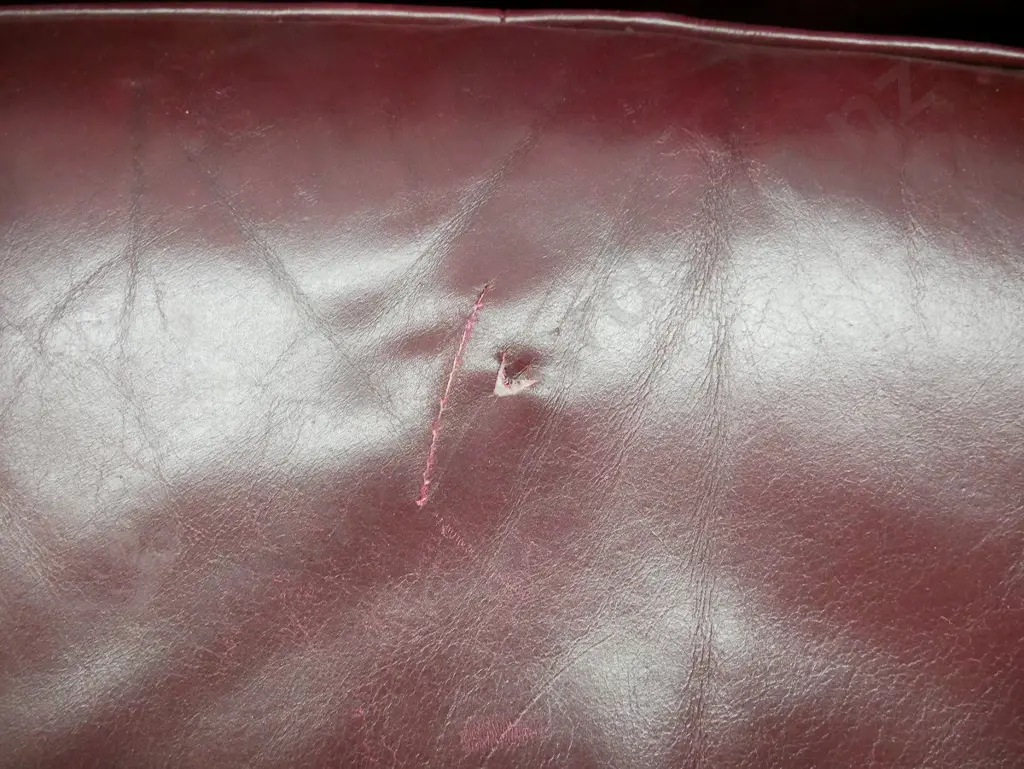 rolled arm chesterfield deep-button & studded burgundy leather 2-seater settee. Some age wear to leather H730 W1630 D900 Image 1++