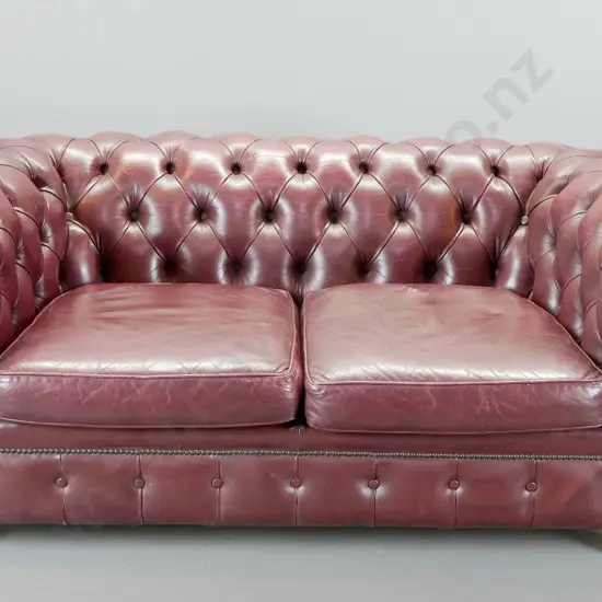 rolled arm chesterfield deep-button & studded burgundy leather 2-seater settee. Some age wear to leather H730 W1630 D900