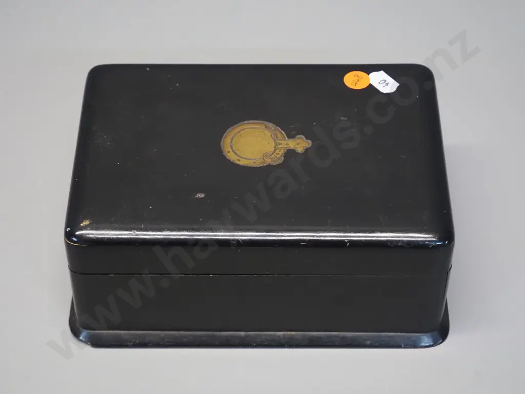 vintage ebonised timber box with hinged top and front, gilt decoration on top, has chip to base, wear to fabric lining. Image 1++