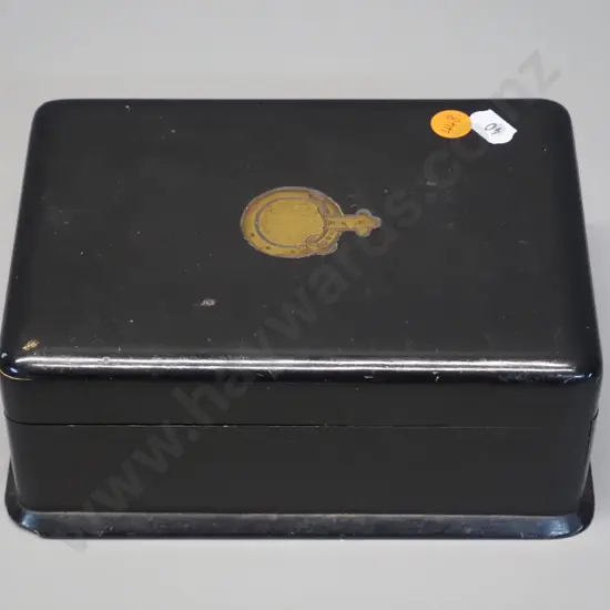 vintage ebonised timber box with hinged top and front, gilt decoration on top, has chip to base, wear to fabric lining.