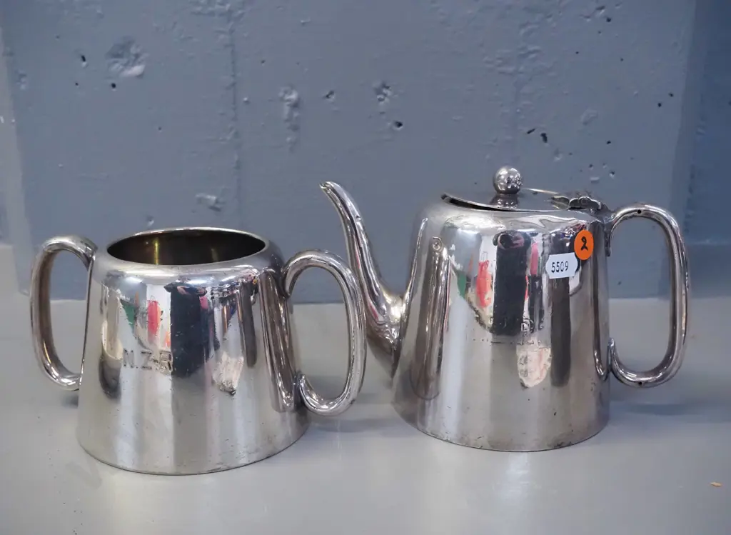2 plated New Zealand Railways items - tea pot H-140 and sugar bowl, both marked NZR, some wear and dents Image 1++
