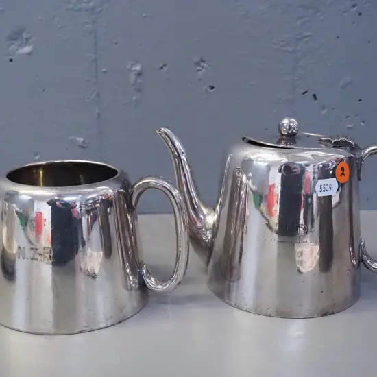 2 plated New Zealand Railways items - tea pot H-140 and sugar bowl, both marked NZR, some wear and dents