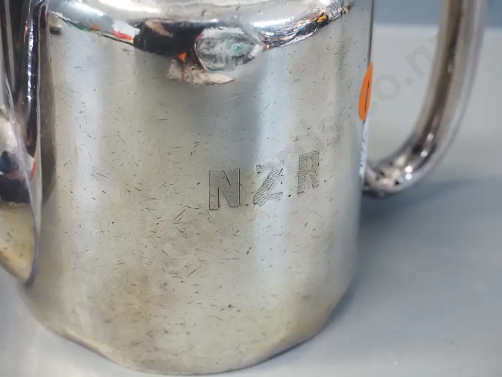 2 plated New Zealand Railways items - tea pot and hot water pot, both marked NZR, some wear and dents, plus a booklet on Image 1++