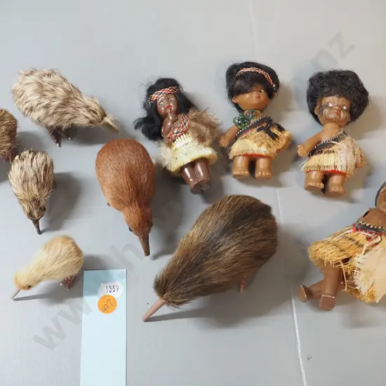 collection of small plastic souvenir Maori theme dolls and kiwi birds, with fur and/or feather adornment - one doll has