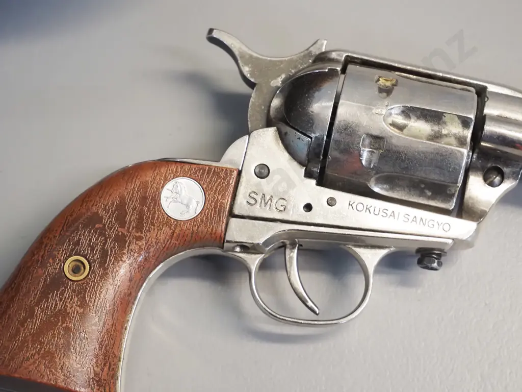 tooled leather gun belt and a vintage American style ornamental revolver. Image 1++