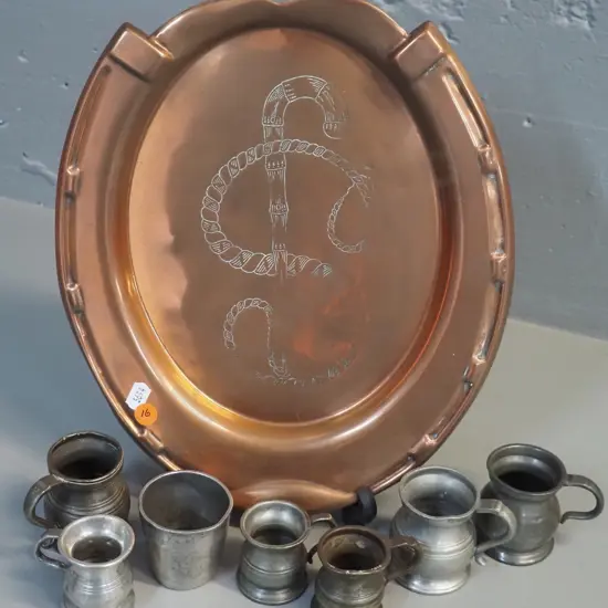 etched and pressed copper tray and 7 pewter spirit measures/ Tray is L-340 W-270