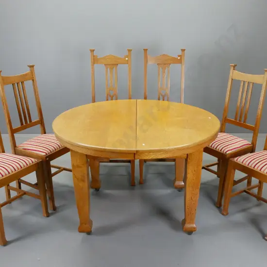 Arts & Craft style, oak extending dining table w/ 6 chairs. 2 chair backs higher than others, general condition good but