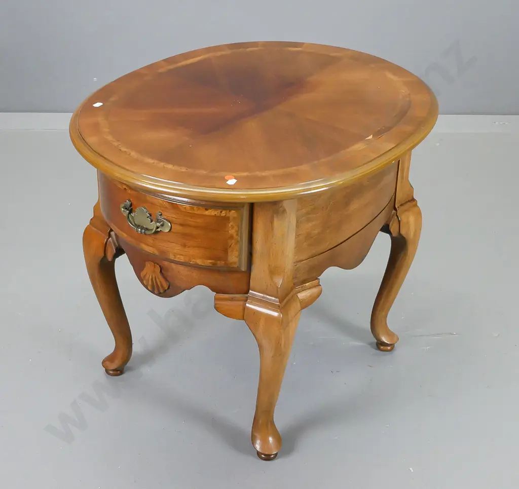reproduction mahogany cab-leg oval side table with drawer w/quartered veneer top with banded edge, small piece of veneer Image 1++