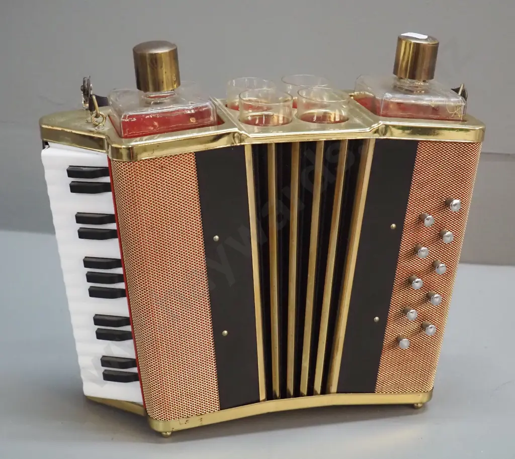 retro liqueur set with accordion shaped holder, 2 bottles, 4 glasses, music mechanism working. Decoration mostly worn Image 1++