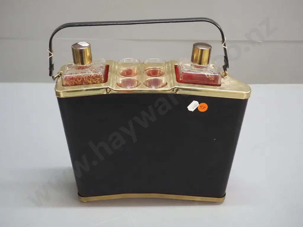 retro liqueur set with accordion shaped holder, 2 bottles, 4 glasses, music mechanism working. Decoration mostly worn Image 1++