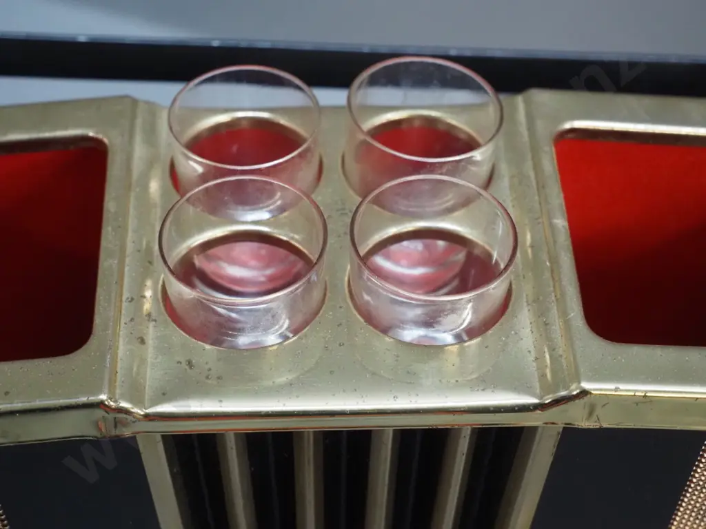 retro liqueur set with accordion shaped holder, 2 bottles, 4 glasses, music mechanism working. Decoration mostly worn Image 1++