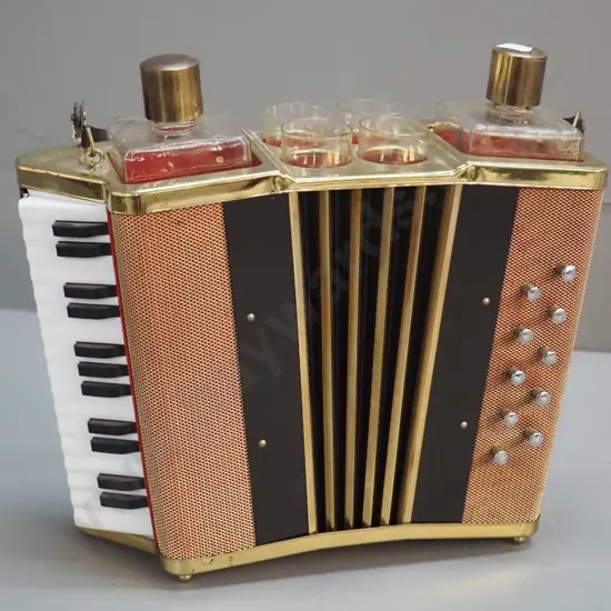 retro liqueur set with accordion shaped holder, 2 bottles, 4 glasses, music mechanism working. Decoration mostly worn