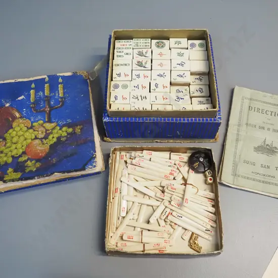 vintage mahjong set with bone & bamboo pieces and counters, with instruction sheet. Round counter repaired, box not