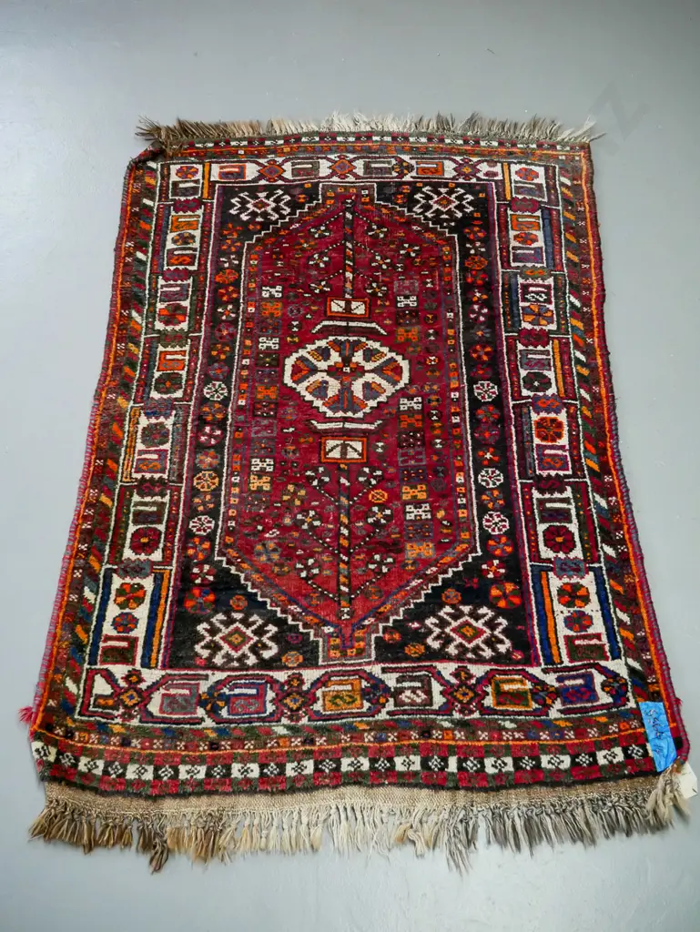 handknotted Iranian rug, central geometric motif, in reds blues and saffron, geometric border Image 1++