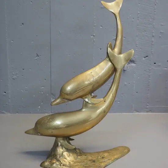 brass figure of 2 swimming dolphins - some pitting, needs cleaning H-440 W-300