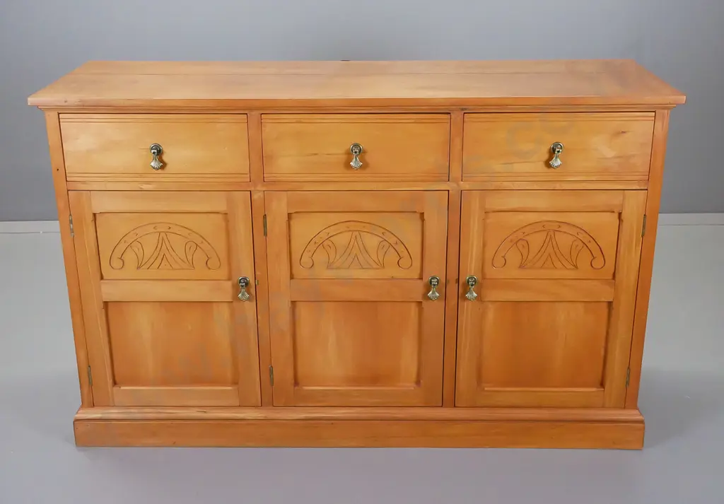 rimu entertainment unit in Edwardian style, brass drop handles, three carved panels in front Image 1++