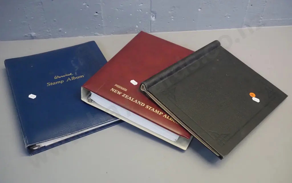 3 New Zealand stamp albums with assorted contents, 1873 onwards Image 1++