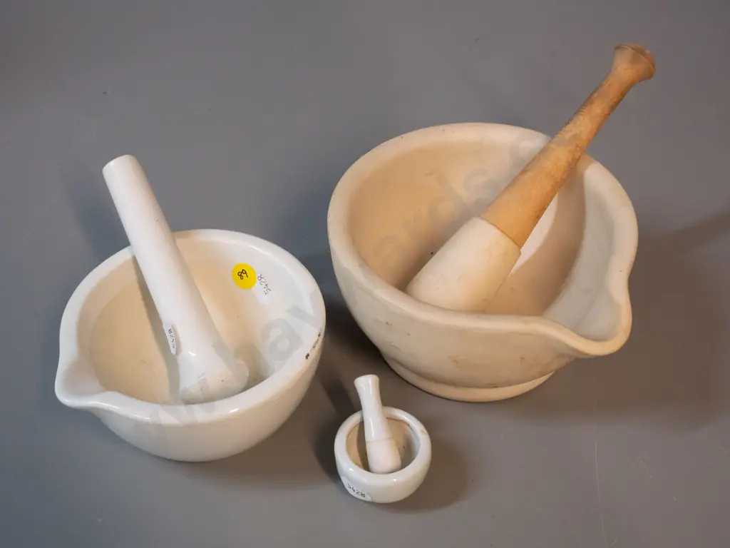 3 mortars and pestles - larger is D-150, wooden handled pestle - some staining and wear Image 1++
