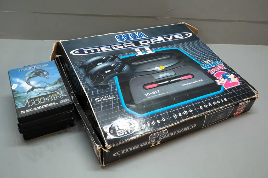 Sega Megadrive videogame console with 2 controllers, 6 game cartridges including Sonic Hedgehog, Jurassic Park etc. Image 1++