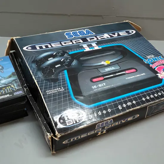 Sega Megadrive videogame console with 2 controllers, 6 game cartridges including Sonic Hedgehog, Jurassic Park etc.