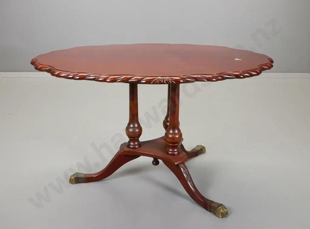 reproduction mahogany side table with scalloped shape top and rope edge on three turned columns Image 1++