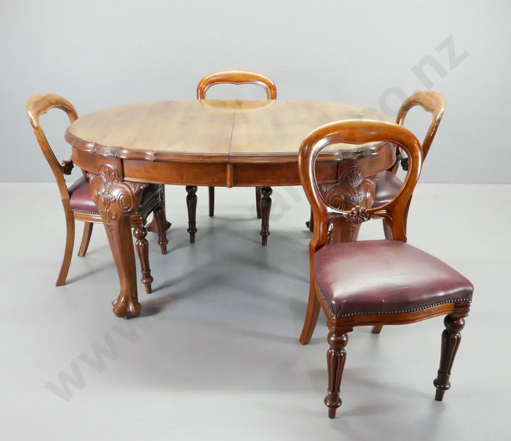 antique heavily carved mahogany dining suite with 8 studded burgundy leather balloon back chairs, oval crank extending Image 1++