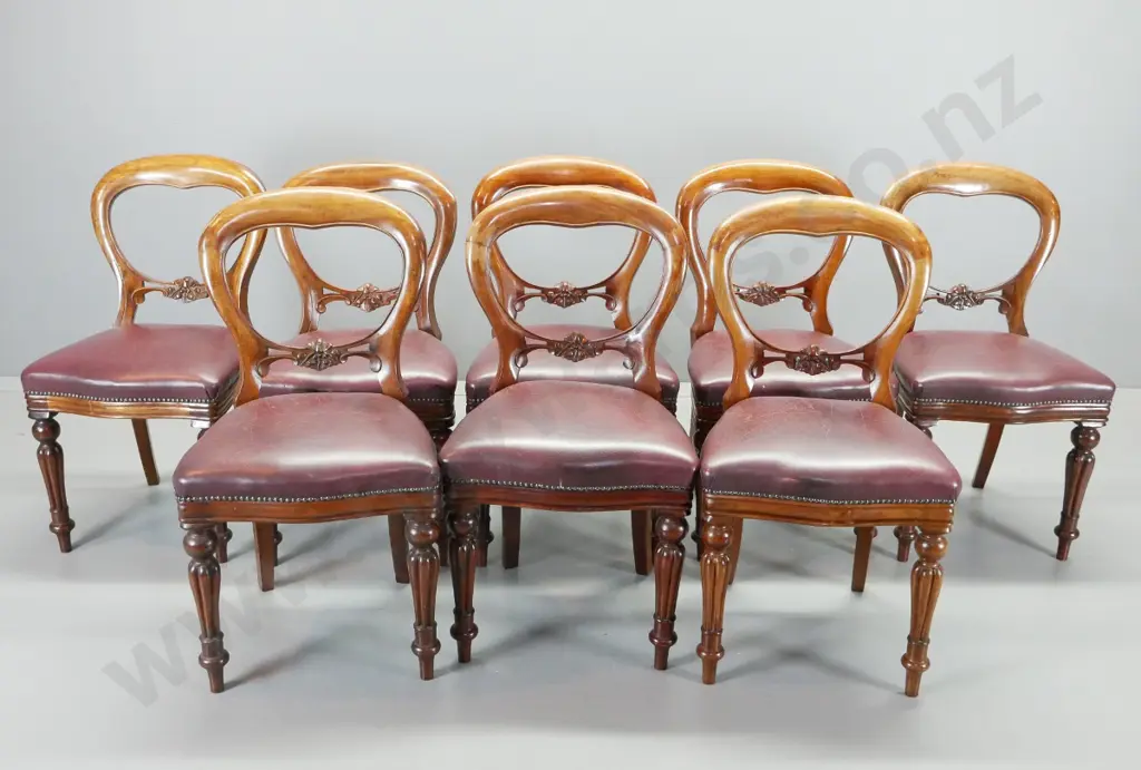 antique heavily carved mahogany dining suite with 8 studded burgundy leather balloon back chairs, oval crank extending Image 1++