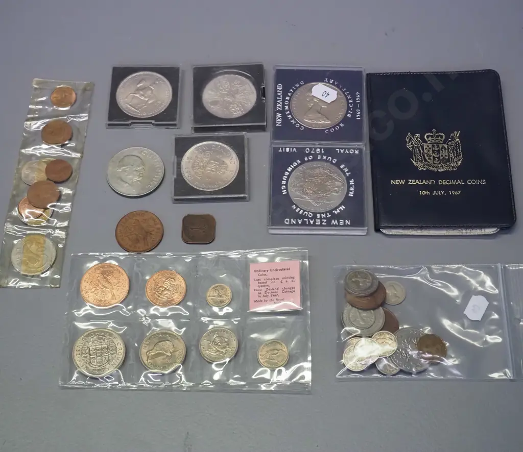 assorted New Zealand coins including cased Coronation, royal visit and Captain Cook, plus English Winston Churchill Image 1++