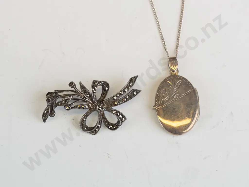 oval locket stamped 925 & marcasite brooch Image 1++