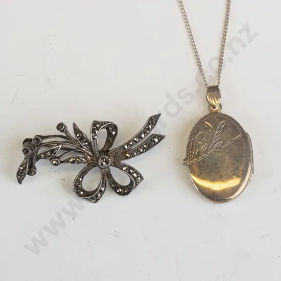 oval locket stamped 925 & marcasite brooch