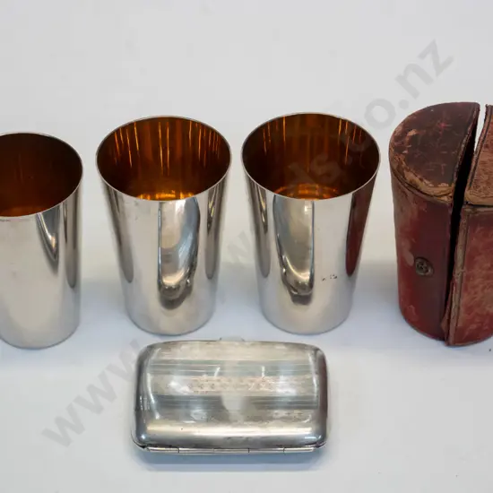 3 silver mugs in case marked WMF[case broken] & small silver cigarette case marked Anchor, lion & S
