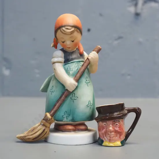 Hummel figurine H-120 and a miniature Lancaster character jug