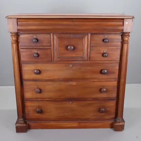 colonial cedar full sized chest of drawers, turned columns on side, shaped long drawer at top above central hat drawer