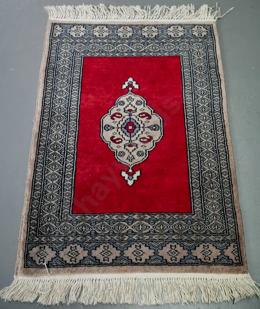 handknotted woollen kashan rug, red ground with central floral motif, multiple blue shaded geometric borders, Image 1++
