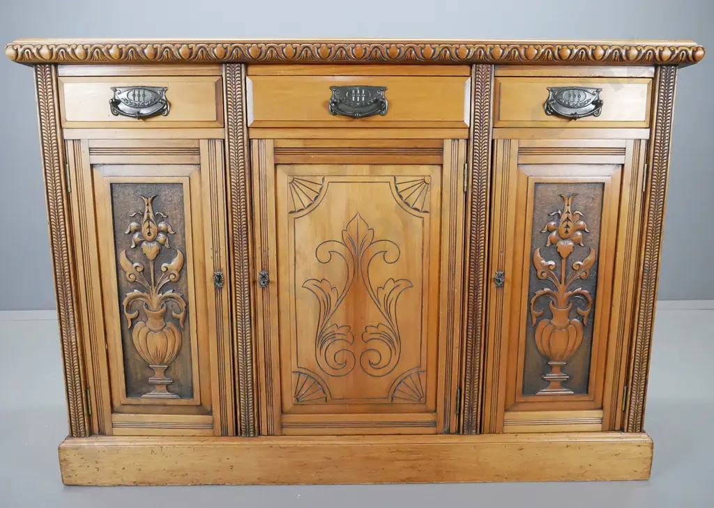 colonial kauri dresser base with carved double edge, three drawers above three carved cupboard doors Image 1++