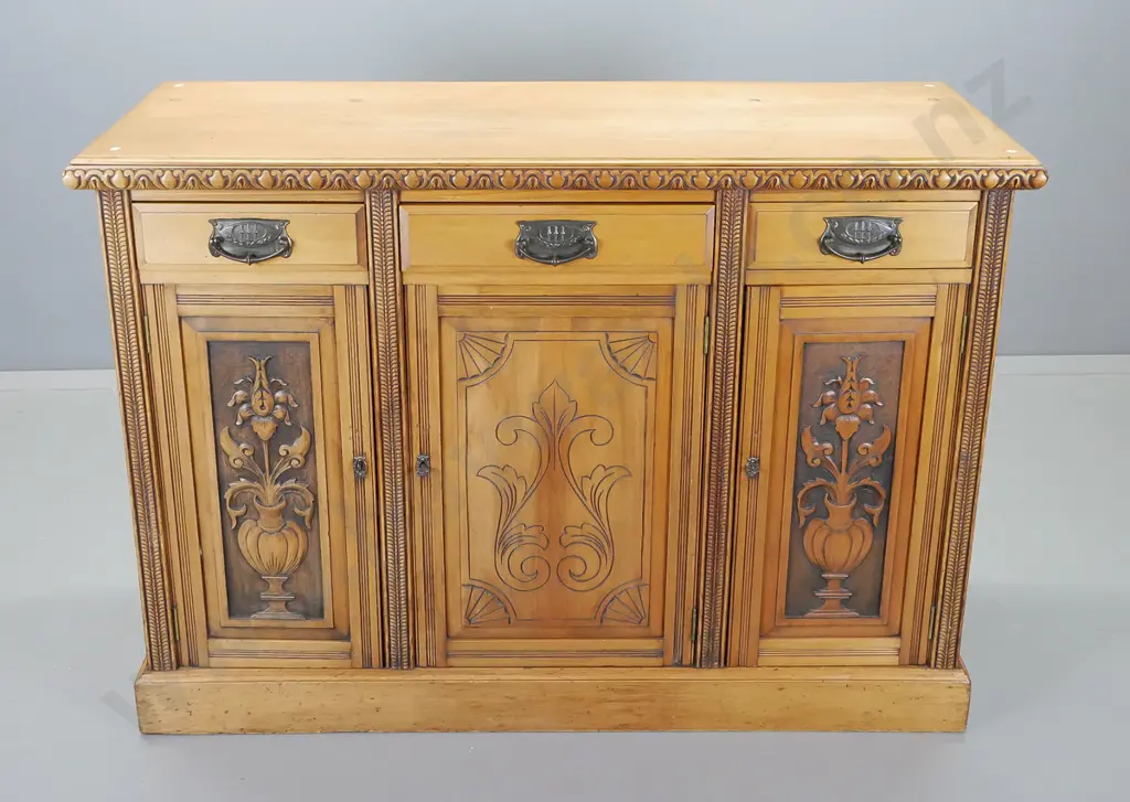 colonial kauri dresser base with carved double edge, three drawers above three carved cupboard doors Image 1++