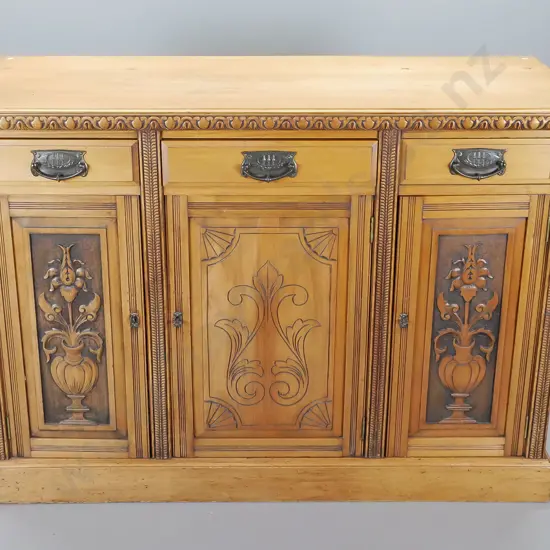 colonial kauri dresser base with carved double edge, three drawers above three carved cupboard doors