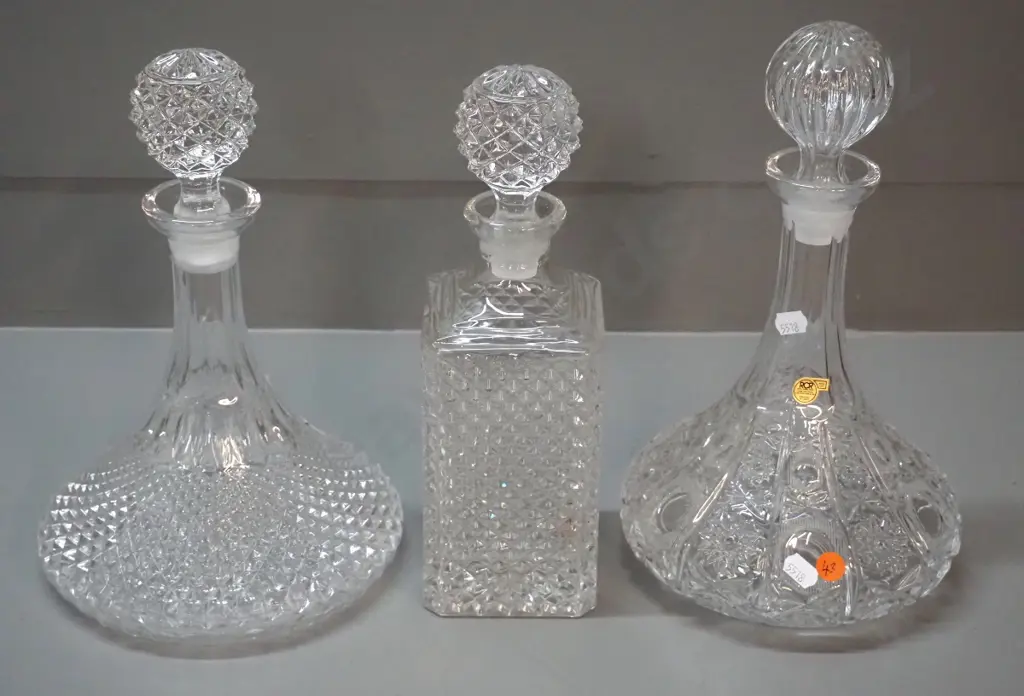 3 stoppered crystal decanters - RCR Italian cut crystal ship's decanter H300 D180, a moulded ship's decanter and Image 1++