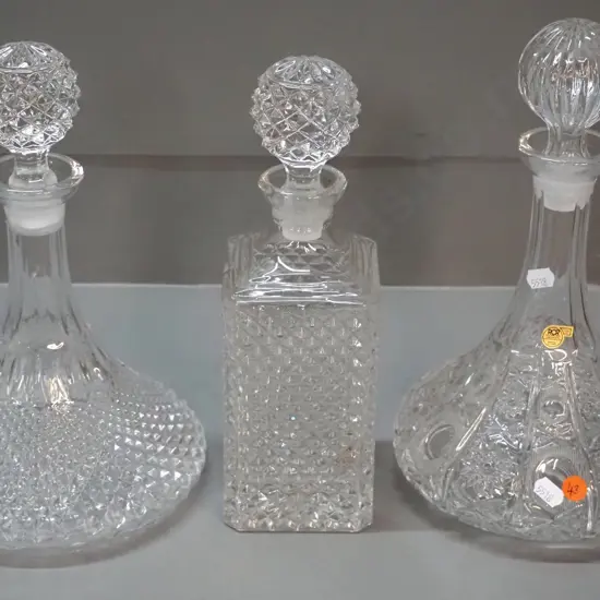 3 stoppered crystal decanters - RCR Italian cut crystal ship's decanter H300 D180, a moulded ship's decanter and