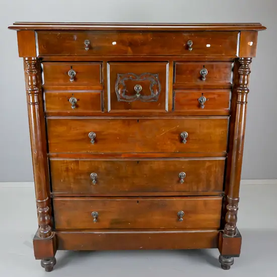 Victorian large 8-drawer Scotch chest with carved details and columns, non-original drop handles, has split to one end,