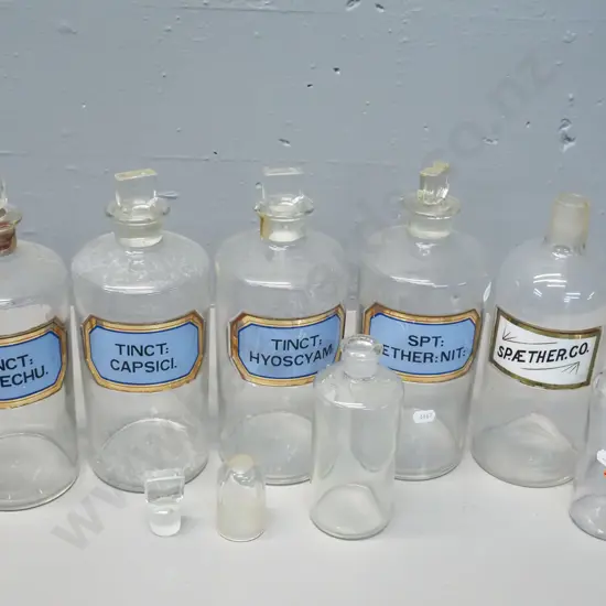 5 stoppered chemist's bottles with labels plus 2 others, some odd stoppers - sticky tape residue on some, 2 don't have