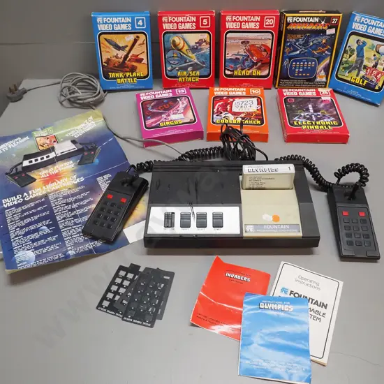 early Fountain video game console with 9 game cartridges, most in original box, w/poster etc.