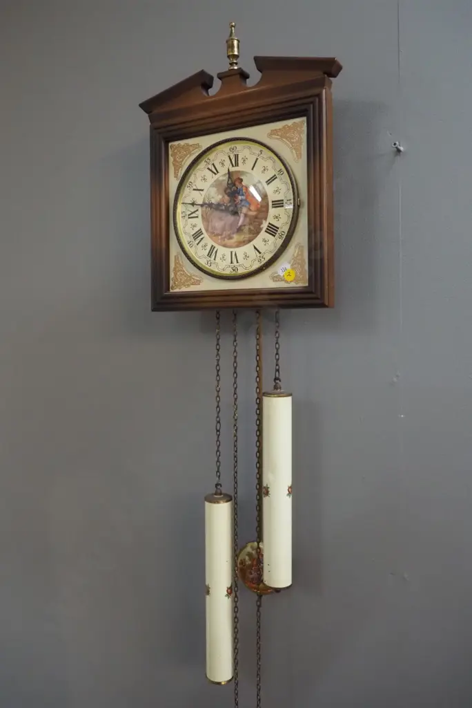 German wall clock with romance scene motif face and pendulum - plastic, porcelain and metal - some dents to weights Image 1++