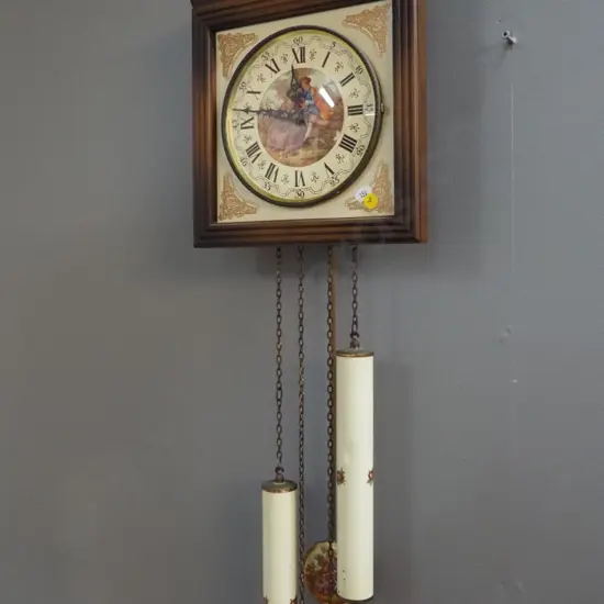 German wall clock with romance scene motif face and pendulum - plastic, porcelain and metal - some dents to weights