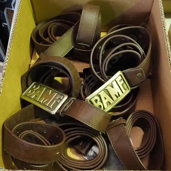 box of Overwatch BAMF vinyl belts with metal buckles