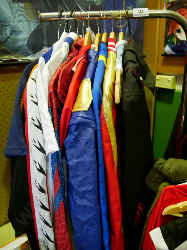 rack of assorted costumes Image 1++