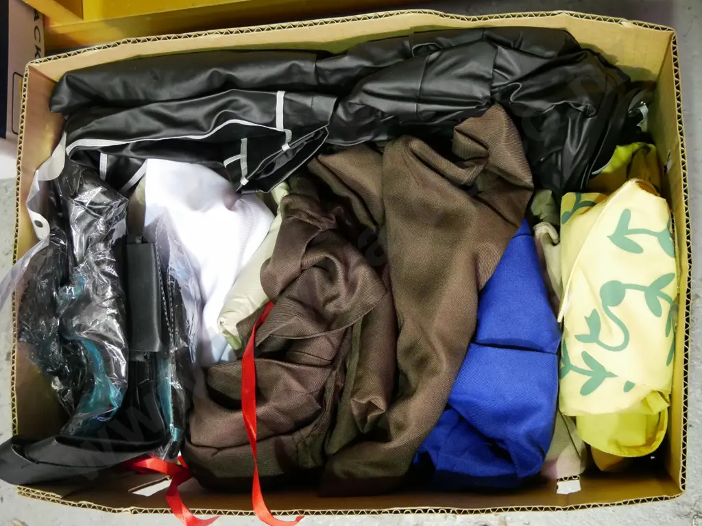 box of opened costumes Image 1++